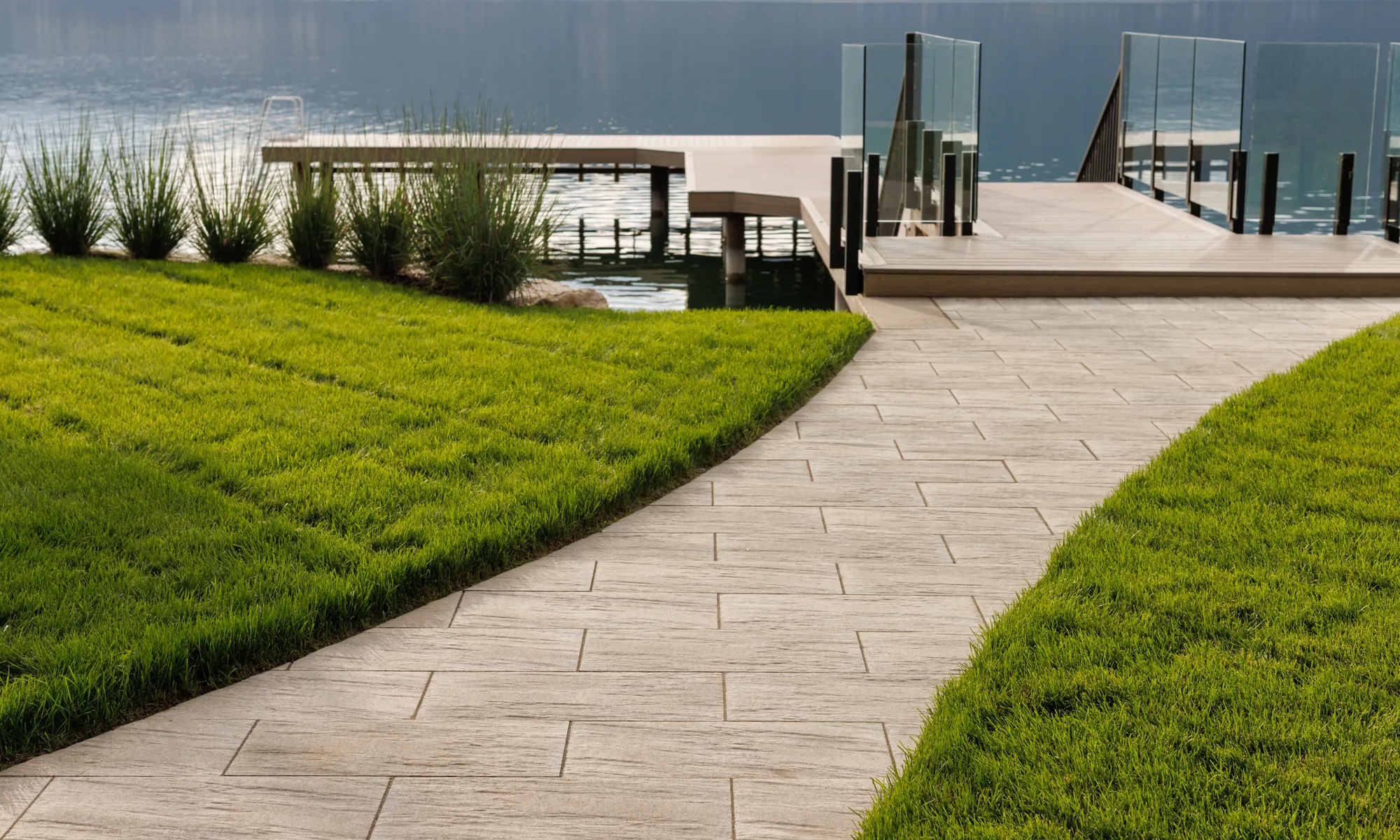 green grass and lakefront property