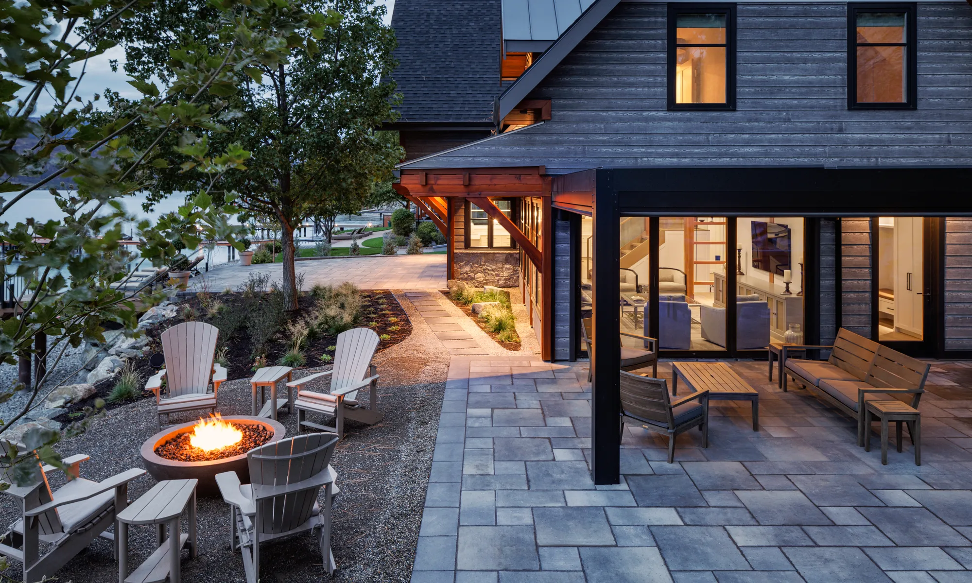 modern home and firepit and stone walkway