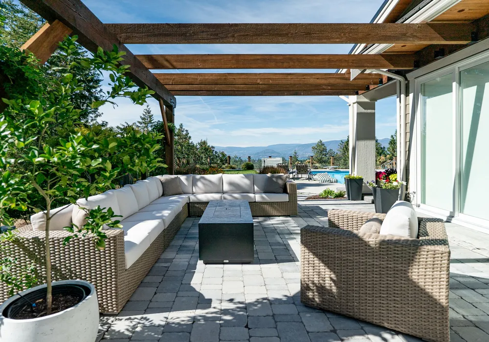 couches and progola and greenery and paver stones
