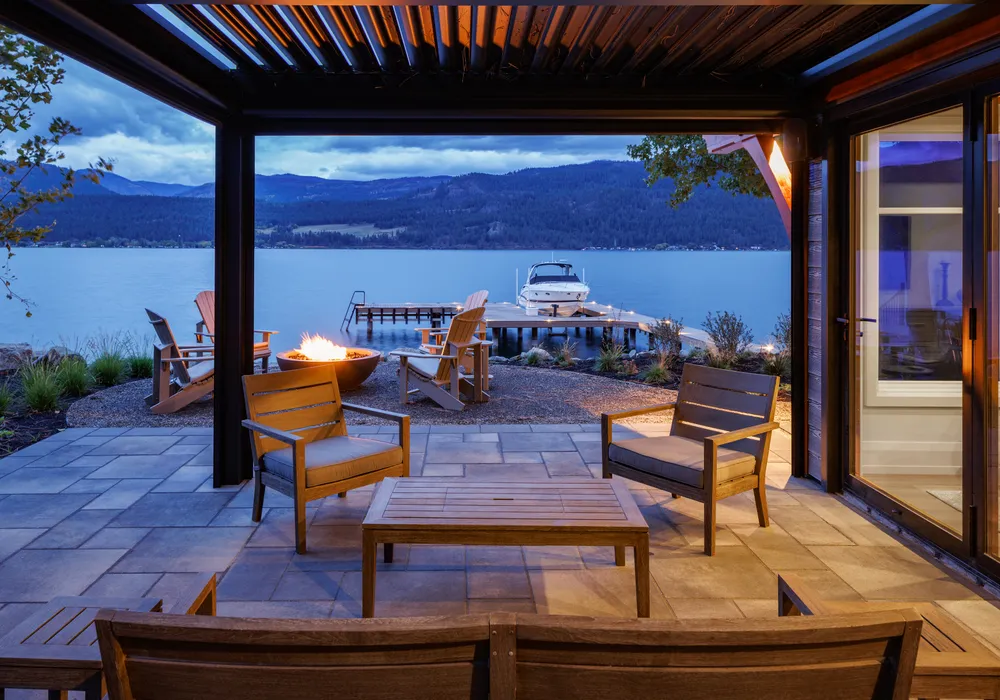 lake dront view and boat and chairs