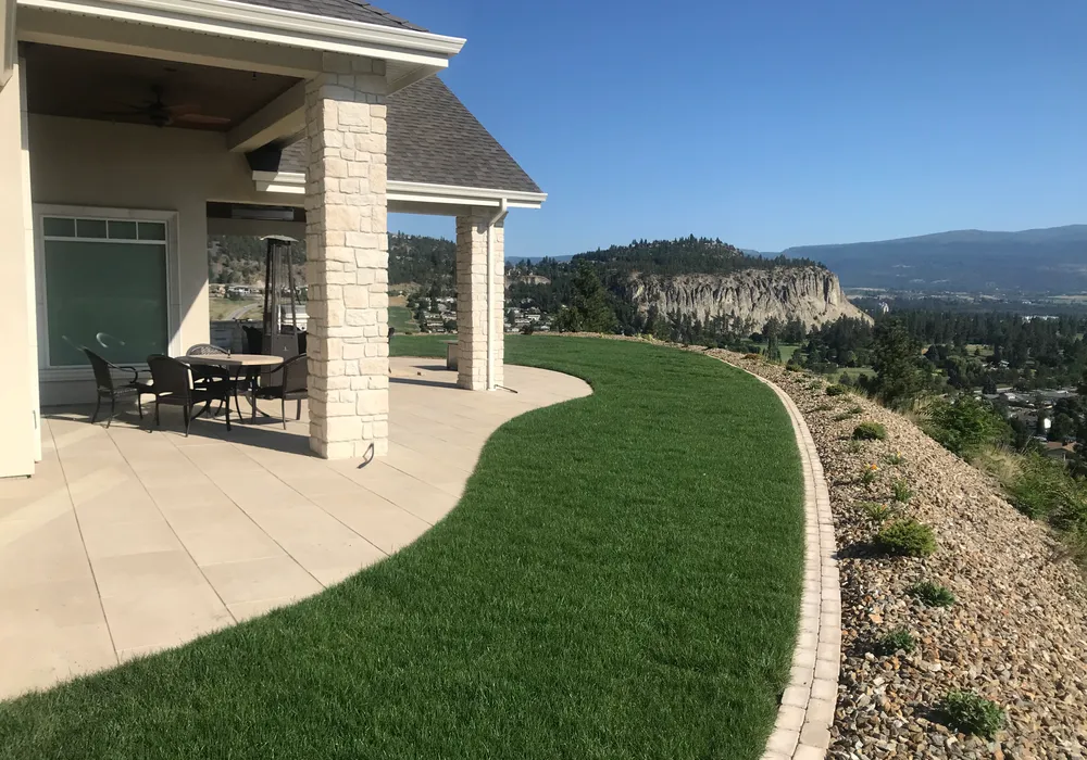 on top of a mountain modern home and yard