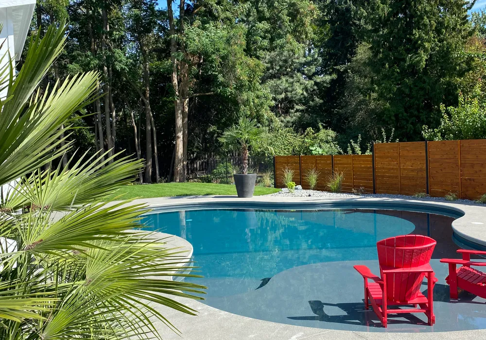 pool and red chairs and stone ground