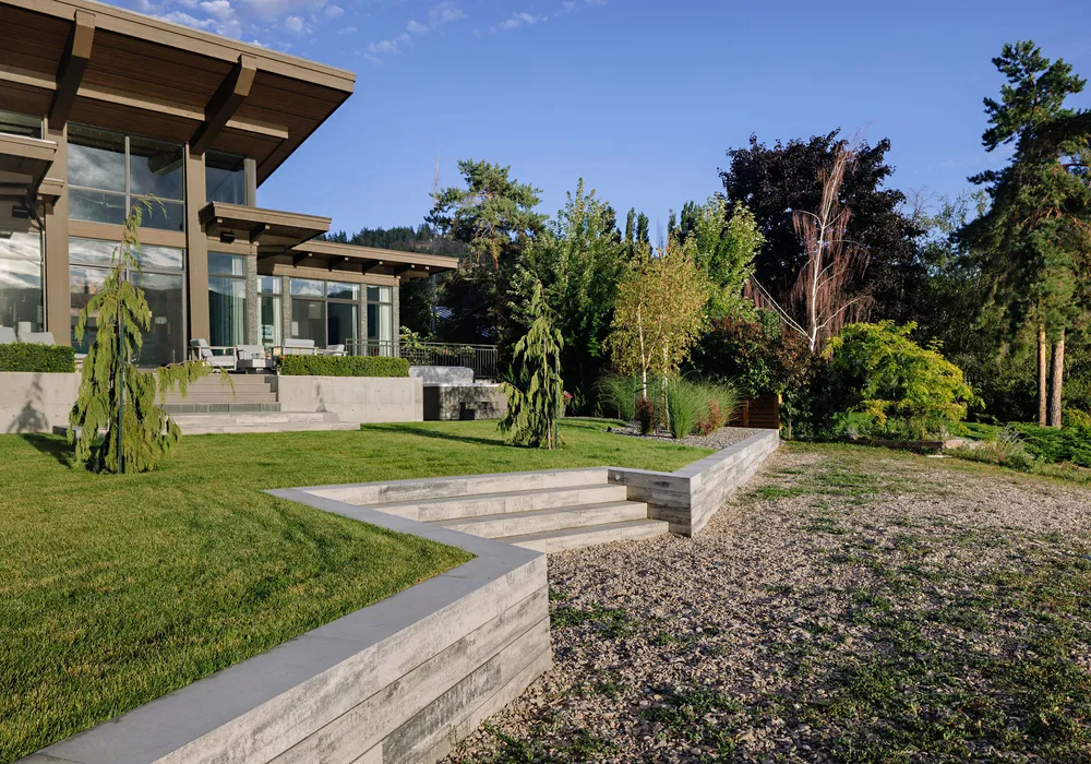 retaining wall and stairs and trees modern home