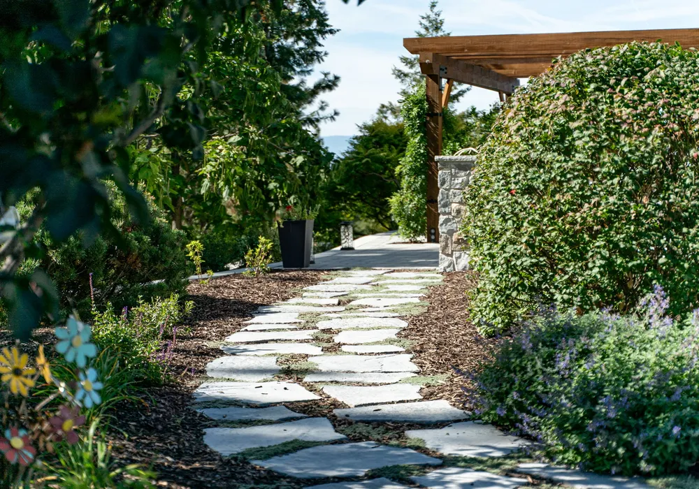 walkway paver stones and shrubs and flowers
